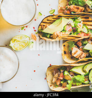 Healthy corn tortillas with chicken, vegetables, limes, square crop Stock Photo