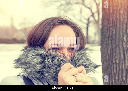 Young woman in the winter park Stock Photo