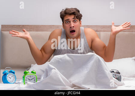 Man having trouble waking up in the morning Stock Photo