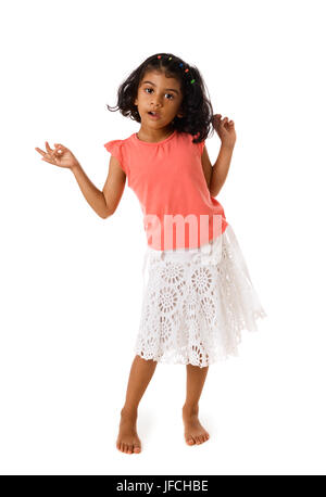 Cute little girl standing barefoot on white background Stock Photo