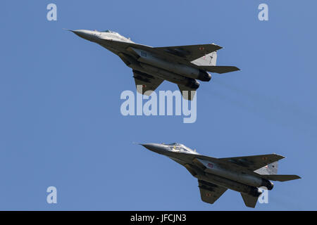 FLORENNES, BELGIUM - JUN 15, 2017: Two Polish Air Force MiG-29 Fulcrum fighter jet flying over the FLorennes Airbase. Stock Photo