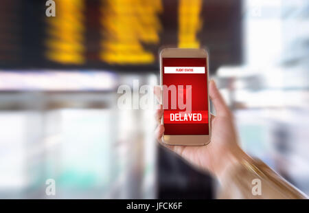 Flight delayed. Delay in flying schedule. Aeroplane will take off late. Smartphone application announces bad news to tourist. Woman holding mobile. Stock Photo