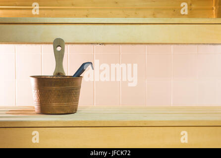 Traditional and authentic Finnish city sauna. Wooden bench and tiles in the wall in Finland. Also suitable for background template and design. Stock Photo