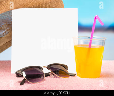 Summer sale or offer background for advertising. White square paper card on towel with sunglasses and yellow cocktail drink. Stock Photo