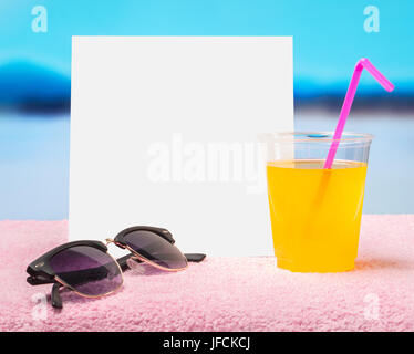 Summer sale or offer background for advertising. White square paper card on towel with sunglasses and yellow cocktail drink. Stock Photo