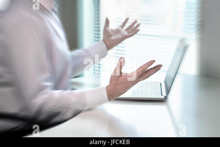 Confused and stressed businessman spreading hands in office and don't know what to do. Problem with failing business or confusion with crisis. Stock Photo