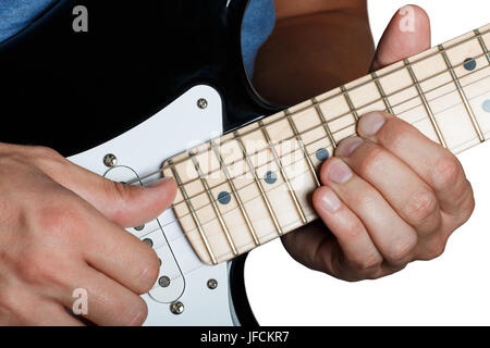 Hands of man playing electric guitar. Guitarist hands. Fingers bending strings on maple fretboard closeup isolated on white. Bend technique. Stock Photo