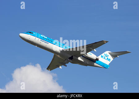 AMSTERDAM - AUG 8: KLM Fokker 70 taking off from Schiphol airport on August 8, 2013, Amsterdam, The Netherlands. KLM is the flag carrier airline of Th Stock Photo