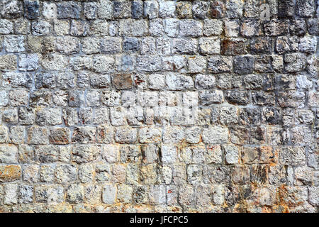 Texture of old fortified stone wall, architecture background Stock Photo