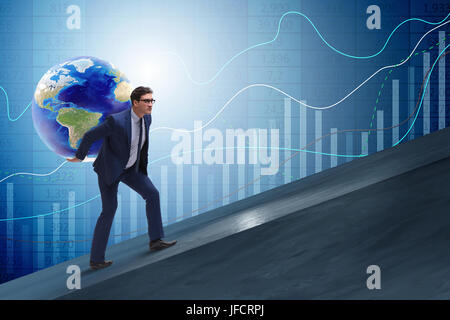 Businessman carrying Earth on his shoulders Stock Photo