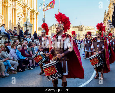 Inhabitants of Zejtun / Malta had their traditional Good Friday procession in front of their church, some of them dressed like Roman legionaries Stock Photo