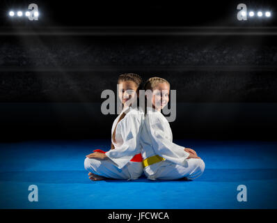 Girls martial arts fighters in sports hall Stock Photo