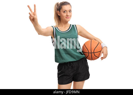 Female basketball player making a victory sign isolated on white background Stock Photo