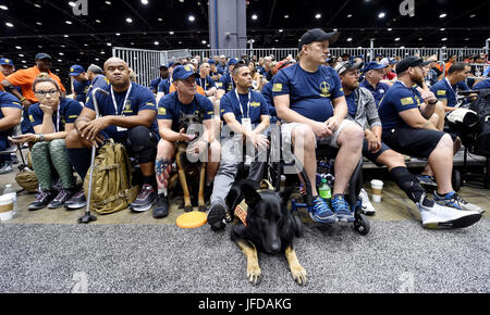 170629-N-VE701-046 CHICAGO (June 29, 2017) - Team Navy attends the athlete welcome event June 29 at the McCormick Place Convention Center Lakeside Center, Chicago, Illinois. The DoD Warrior Games are an annual event allowing wounded, ill and injured service members and veterans to compete in Paralympic-style sports including archery, cycling, field, shooting, sitting volleyball, swimming, track and wheelchair basketball. (U.S. Navy photo by Mass Communication Specialist 2nd Class David R. Finley Jr./ Released) Stock Photo