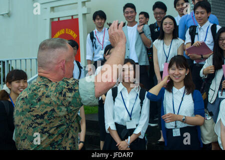 Approximately 30 Japanese students participate in the Japan-America Student Conference at III Marine Expeditionary Force Headquarters in Camp Courtney, Okinawa, engaging in educational and cultural exchange focused on military presence and U.S.-Japan alliance. Stock Photo