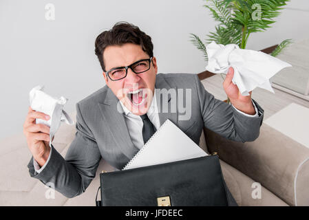 Angry businessman with crumbled paper Stock Photo