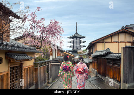 Couple asian women wearing traditional japanese kimono in Yasaka Pagoda and Sannen Zaka Street in Kyoto, Japan