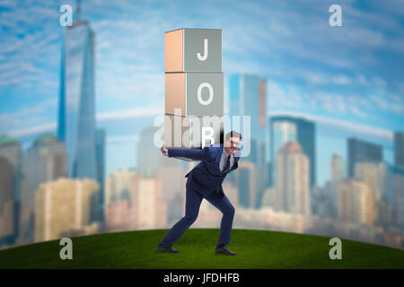 Businessman carrying the burden of his job Stock Photo