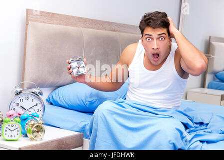 Man having trouble waking up in morning Stock Photo