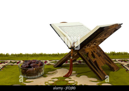 Quran on wood stand on white background and dates Stock Photo