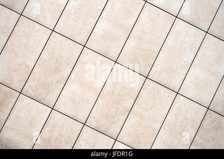 Detail of light beige tile wall texture background Stock Photo