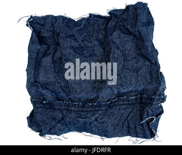 Piece of crumpled blue jeans fabric isolated on white background. Rough uneven edges. Wrong side of fabric Stock Photo