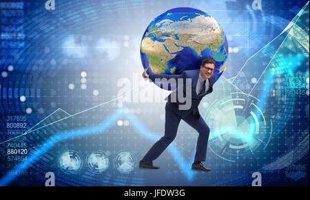 Businessman carrying Earth on his shoulders Stock Photo