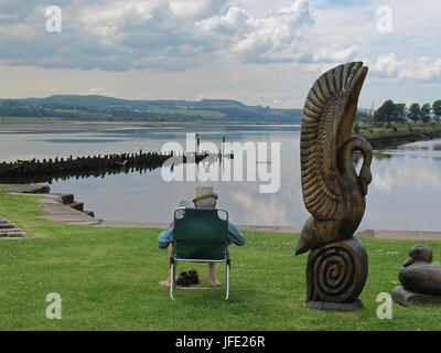 sun lounger camp seat tourists enjoying recreation Bowling Harbour graving docks Forth and Clyde canal Stock Photo