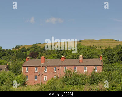 Bowling tenements with Kilpatrick hills blue sky Stock Photo