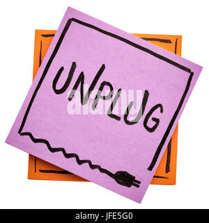 unplug  - lifestyle or information overload concept  - handwriting on an isolated sticky note Stock Photo