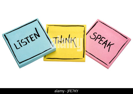 listen, think, speak - communication concept - handwriting in black ink on isolated sticky notes Stock Photo