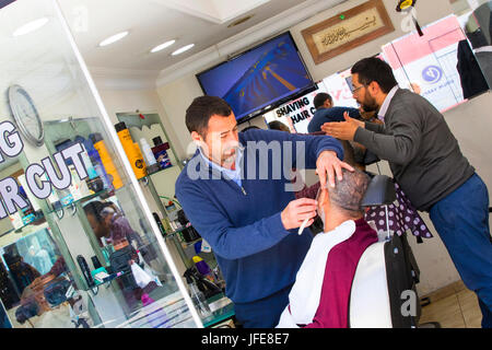 ISTANBUL, TURKEY - 1 APRIL , 2017:Hairdresser man shearing client at Istanbul hair salon Istanbul Stock Photo