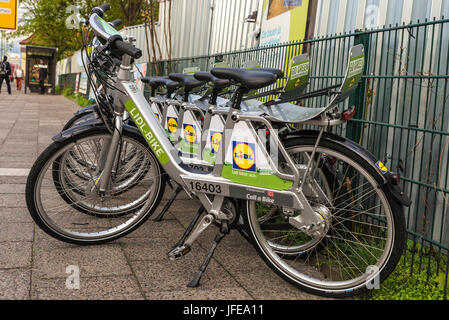 Berlin, Germany - April 13, 2017: A row of rental bikes of Lidl in their docking stands  in Berlin, Germany. Stock Photo