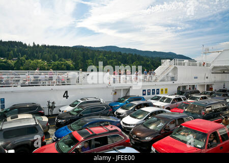 Ferry between Salt Spring Island and Vancouver Island, with vehicles and passengers on deck. BC Ferries ship. Stock Photo