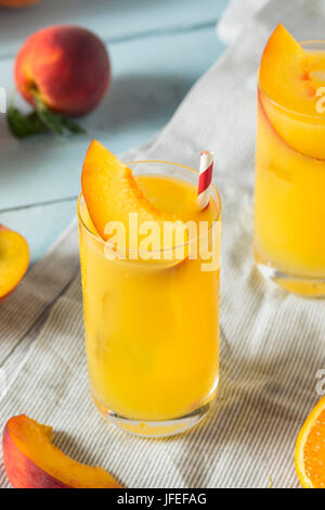 Refreshing Peach and Orange Fuzzy Navel Cocktail with a Garnish Stock Photo