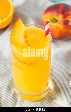 Refreshing Peach and Orange Fuzzy Navel Cocktail with a Garnish Stock Photo