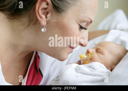 Mother in the hospital with a newborn child Stock Photo