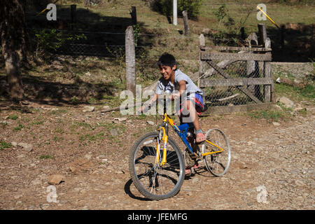 Chile, Araucania, Alto bio bio, Mapuche, boy, bicycle drive, Stock Photo