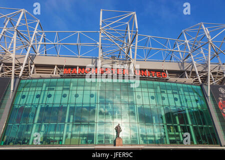 England, Manchester, Salford, Old Trafford Football Stadium and Statue of Sir Matt Busby Stock Photo