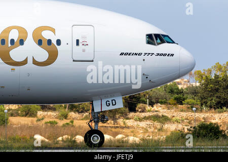 Emirates Boeing 777-36N/ER [A6-EBG] backtracking runway 31 for departure. Stock Photo