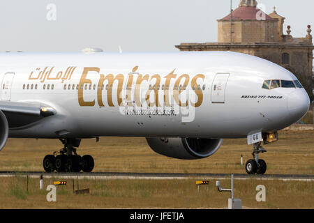 Emirates Boeing 777-36N/ER [A6-EBG] backtracking runway 31 for departure. Stock Photo