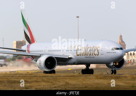 Emirates Boeing 777-36N/ER [A6-EBG] backtracking runway 31 for departure. Stock Photo