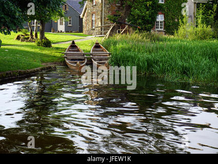 Wooden Rowing Boats on the edge of the water at Lusty Beg Boa  Lough ErneIsland County Fermanagh Northern Ireland Stock Photo