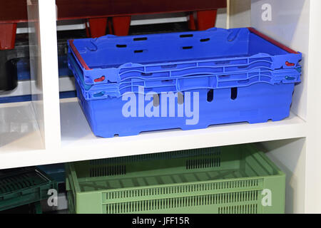 Many Plastic Transport Boxes and Crates Stock Photo - Alamy
