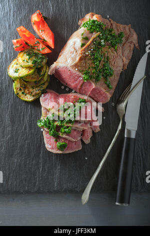 Roast Beef dinner with roasted zucchini Stock Photo