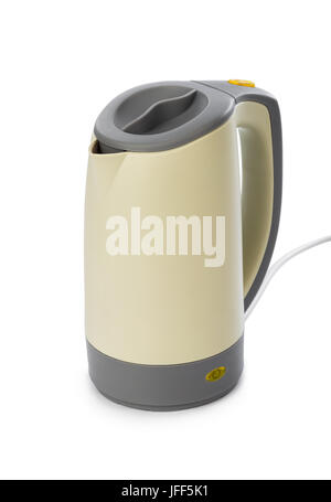 White electric kettle stands on a gray table plugged into a power outlet  Stock Photo - Alamy