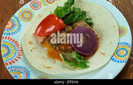 Lamb with hummus and tortillas Stock Photo