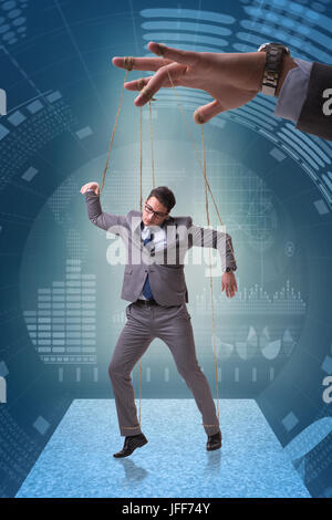 Businessman puppet being manipulated by boss Stock Photo