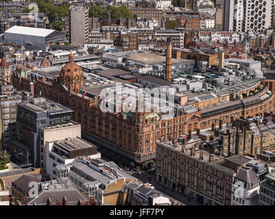 Aerial view over London England including Harrods Store. Harrods is a luxury department store located on Brompton Road in Knightsbridge, London. It is Stock Photo