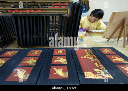 Cambodian craftspeople painting souvenirs at Artisans Angkor store in Siem Reap, Cambodia, Asia Stock Photo